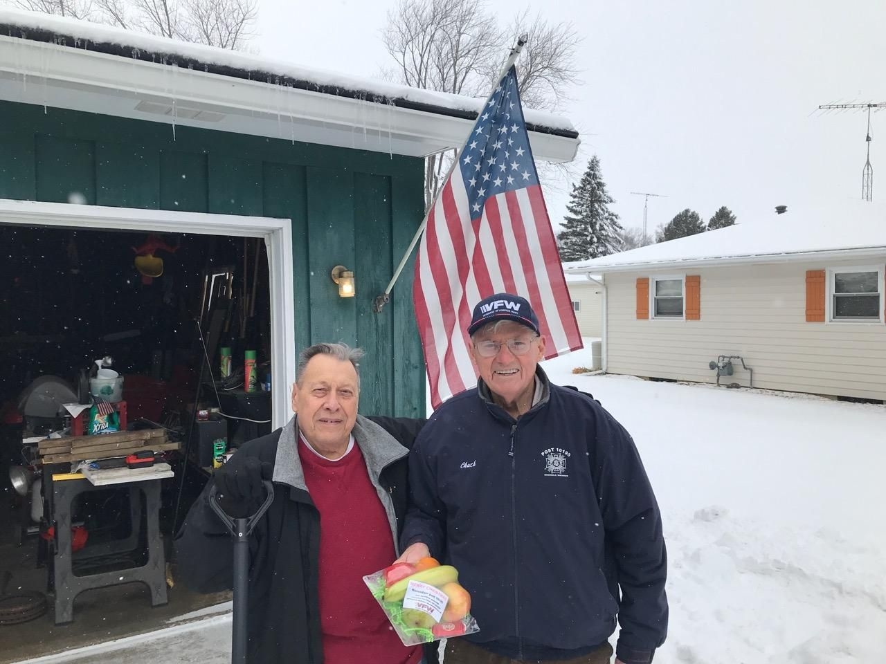 Chuck Rusch delivers a fruit basket to Al Schultz of Rosendale